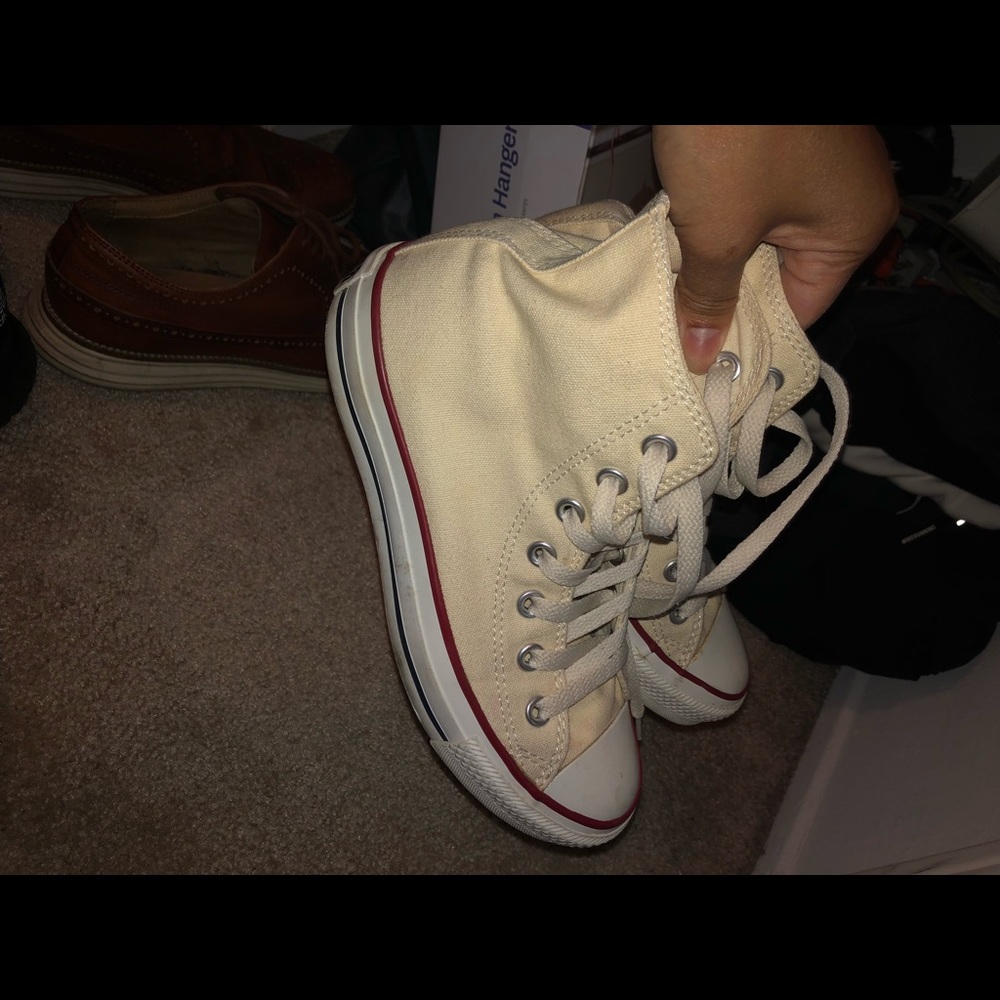 Cream and white high top converse shoes